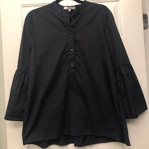 Navy Tibi top with bell sleeves and ruffle back